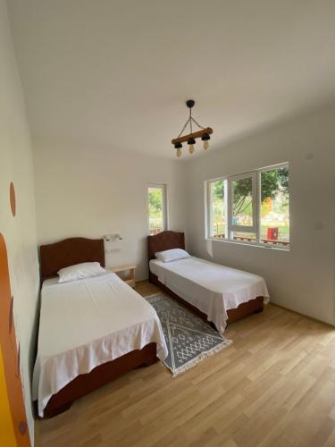 Кровать или кровати в номере Yedi Butik Hotel