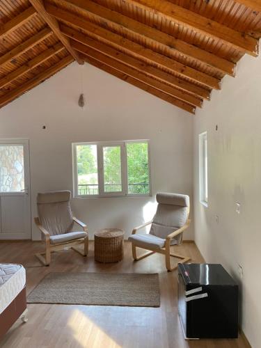 a living room with two chairs and a table at Yedi Butik Hotel in Kemer