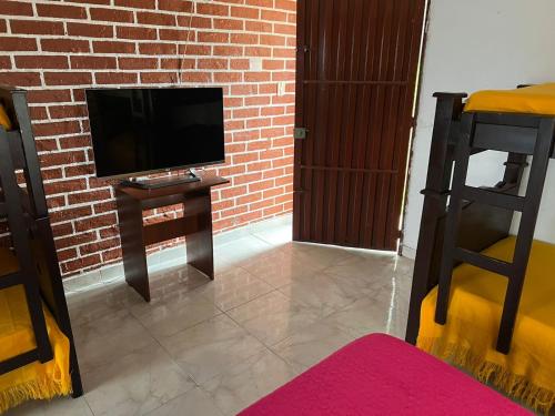 TV a/nebo společenská místnost v ubytování Eco Hotel La Selecta Pereira