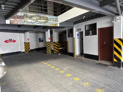 an empty subway station with a car parked in it at Hospedaje Fenix in Cuenca