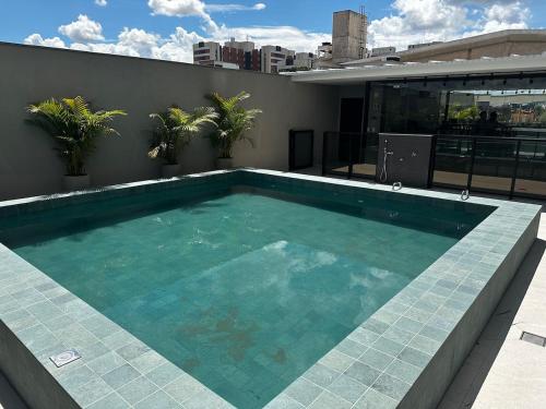 a swimming pool on the roof of a building at PARK SUL - Edifício Essence - 6 in Brasilia