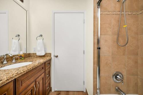 a bathroom with a shower and a sink at Massive Multi Family With Pool Near the Beach in Dania Beach