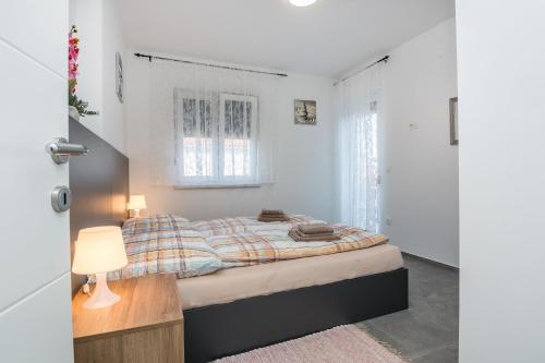 Ένα ή περισσότερα κρεβάτια σε δωμάτιο στο Apartment Spanic 2