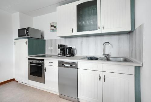 Una cocina o cocineta en 8 Bett Ferienwohnung Spatzennest
