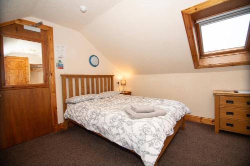 Letto o letti in una camera di Alder Lodge Guest House