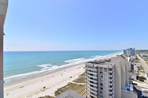a view of the beach from the balcony of a building at Penthouse Stunning Ocean Views Lazy River Indoor Pool in Myrtle Beach