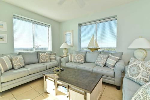 a living room with a couch and a coffee table at Penthouse Stunning Ocean Views Lazy River Indoor Pool in Myrtle Beach