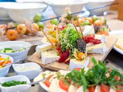 a table topped with lots of different types of food at ACHAT Hotel Bochum Dortmund in Bochum