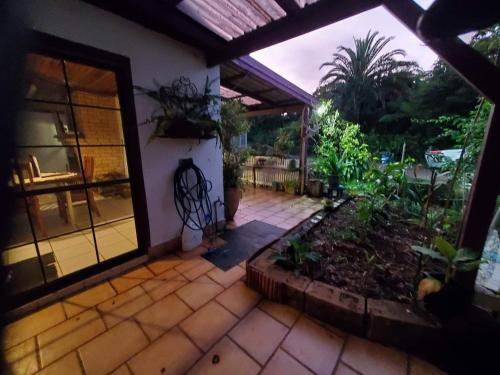 an outside view of a house with a patio at The Boho Nook in Tarzali
