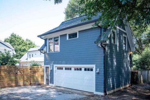 a blue house with a white garage at Prospect in Atlanta