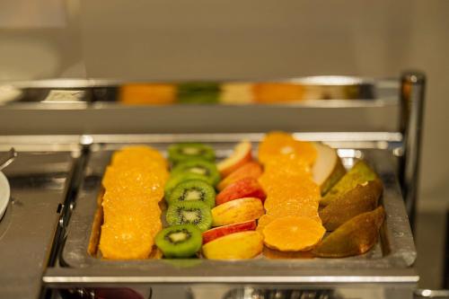 a tray filled with different types of fruits at Best Western Hotel Armando in Verona