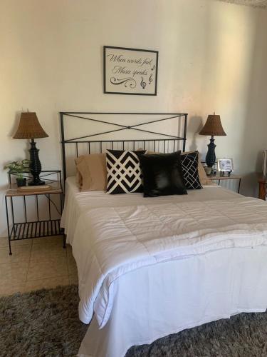 a bedroom with a large bed with pillows on it at Descansa y viaja bleseed house in Monte Adentro