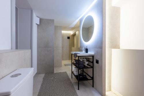 a bathroom with a sink and a mirror at Monciak Comfort - Alejki in Sopot