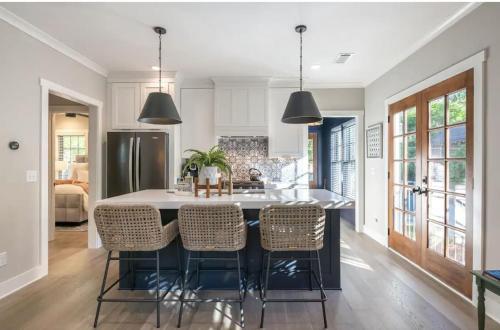 a kitchen with a large table and chairs at Butterfly Bungalow in Atlanta