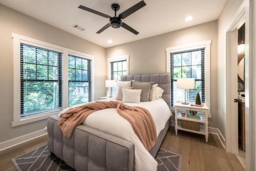 a bedroom with a bed and a ceiling fan at Butterfly Bungalow in Atlanta