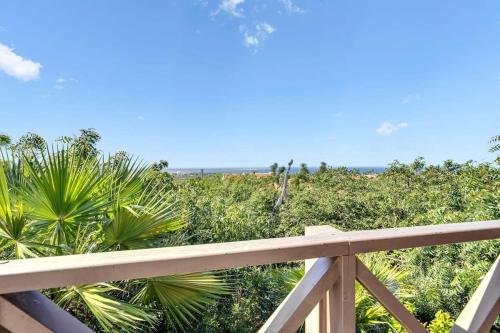 a view of the ocean from a balcony of a beach at Villa Kromboon with an amazing sea view in Kralendijk