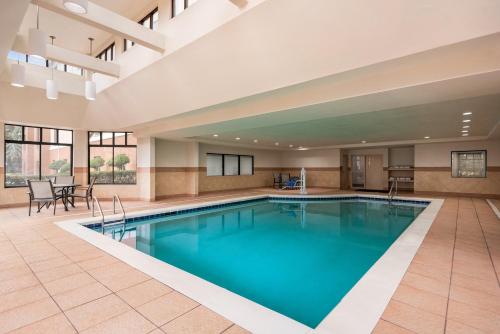 a large pool with blue water in a hotel room at Holiday Inn Express Hotel & Suites McDonough, an IHG Hotel in McDonough