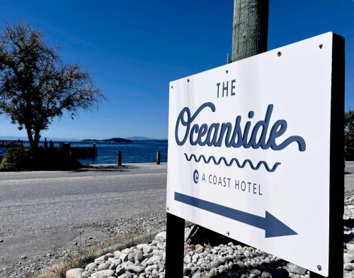 a sign on the side of a road at The Oceanside, a Coast Hotel in Sechelt