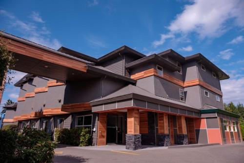 a building with a gambrel roof at Coast Parksville Hotel in Parksville
