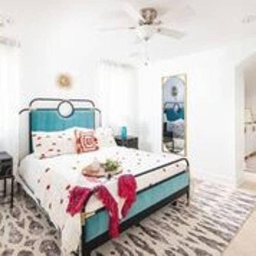 a bedroom with a bed with red bows on it at Parkfront Lux in Atlanta