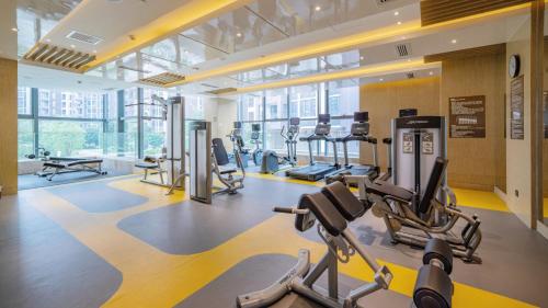 a gym with cardio machines and treadmills in a building at Holiday Inn Shaoguan Downtown by IHG in Shaoguan