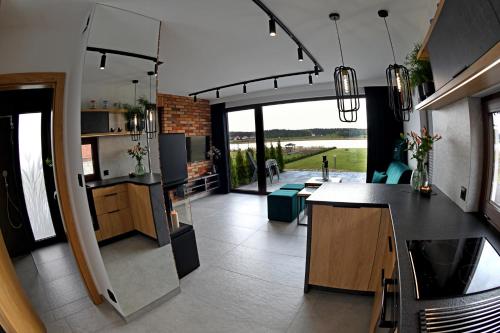 Kuchyň nebo kuchyňský kout v ubytování APARTAMENT JANETTA domek nad jeziorem