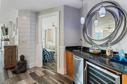 a bathroom with a sink and a mirror at Turquoise Place 2307-C Luxury Gulf Front Condo in Orange Beach