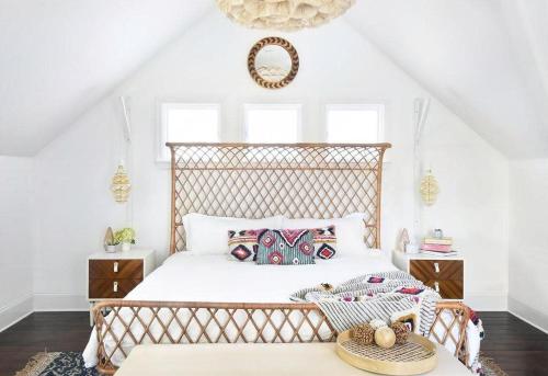 a bedroom with a large bed with a wooden headboard at Boutique La TiQue in Atlanta