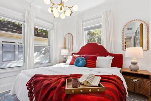 a bedroom with a large bed with a red headboard at Field of Light in Atlanta