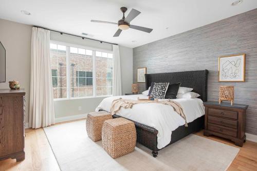 a bedroom with a bed and a ceiling fan at Sky's the Limit in Atlanta