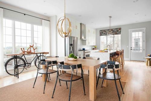 a kitchen and dining room with a table and chairs at Sky's the Limit in Atlanta