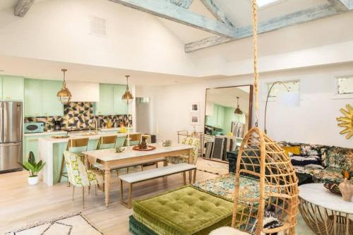 a kitchen and living room with a hanging swing at Penthouse Lux in Atlanta