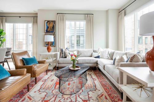 a living room with a couch and a table at Bird's Eye View in Atlanta