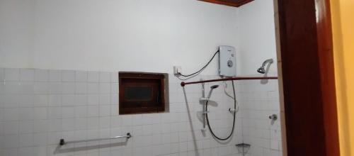 a shower in a bathroom with a window at Ananda Villa Kosgoda Since 1995 in Kosgoda