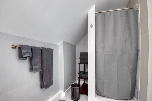 a bathroom with a shower curtain and towels at Mountain Retreat for Adventures - 2nd Floor in Whitefield