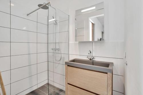 a bathroom with a sink and a shower at Villa Valena Apartment 5 with Cooling Pool in Kralendijk