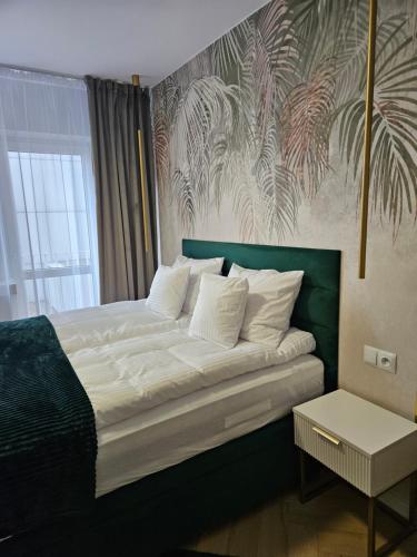 Posteľ alebo postele v izbe v ubytovaní Apartament Deluxe Centrum Warszawa