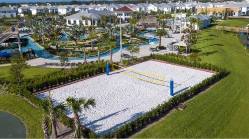 an aerial view of a pool at a resort at Amazing 8br w pool theater game room by Disney in Kissimmee