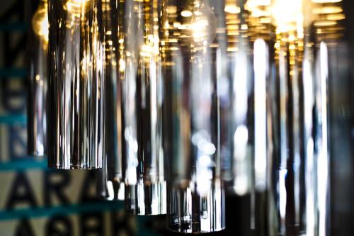 a bunch of wine glasses are lined up at Hotel Spero, Vignette Collection by IHG in San Francisco