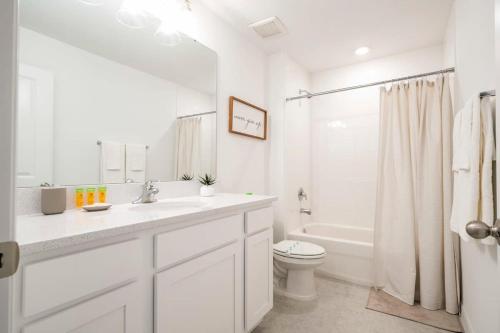 a white bathroom with a sink and a toilet at Charming 3Bd Close to Disney at Enclave 1021 in Davenport