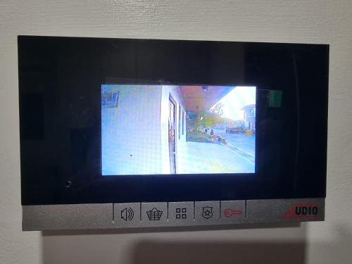 a television with a picture of a street on it at Mary Ann Gurel, Amaya 2 Tanza Cavite Staycation, Transient, Short Term,Long Term, Condo Type with own Balcony. in Tanza