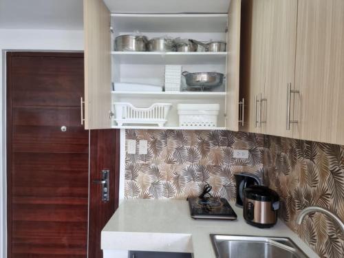 a kitchen with a sink and a counter top at Mary Ann Gurel, Amaya 2 Tanza Cavite Staycation, Transient, Short Term,Long Term, Condo Type with own Balcony. in Tanza
