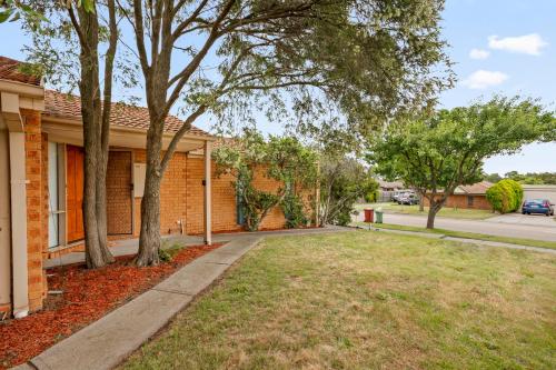 a house with trees in the front yard at StayAU 3BRM Family Home Netflix Pet-Friendly in Narre Warren South