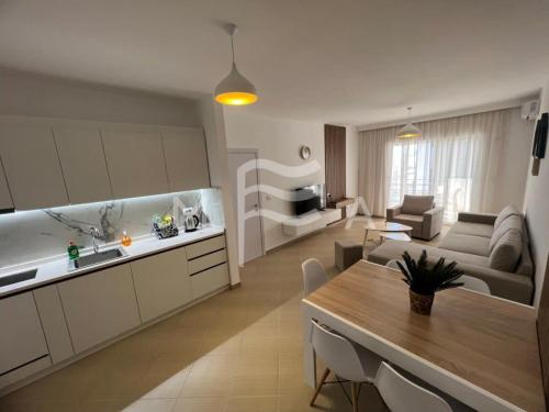 a kitchen and living room with a table and a couch at Spacious Living 828 in Golem