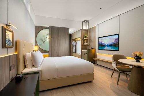Ένα ή περισσότερα κρεβάτια σε δωμάτιο στο Edorer Hotel Shenzhen