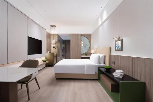 Ένα ή περισσότερα κρεβάτια σε δωμάτιο στο Edorer Hotel Shenzhen