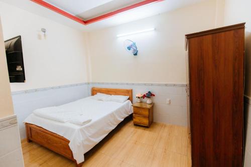 Ένα ή περισσότερα κρεβάτια σε δωμάτιο στο Hotel Trâm Anh 2