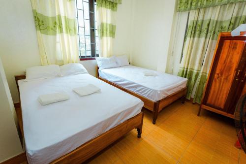 Postel nebo postele na pokoji v ubytování Hotel CÔ CÚC