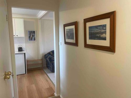 a hallway of a room with a kitchen and a room with a hallway at Forests Edge in Katoomba