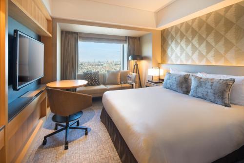 a hotel room with a large bed and a television at Cerulean Tower Tokyu Hotel, A Pan Pacific Partner Hotel in Tokyo